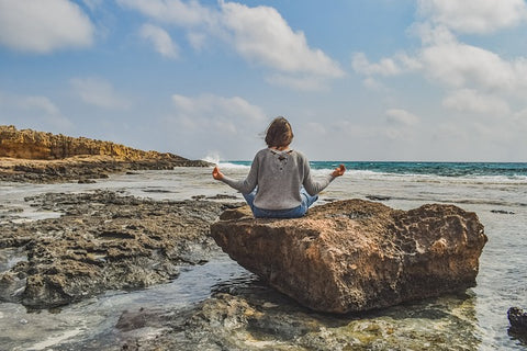 lady in nature meditating